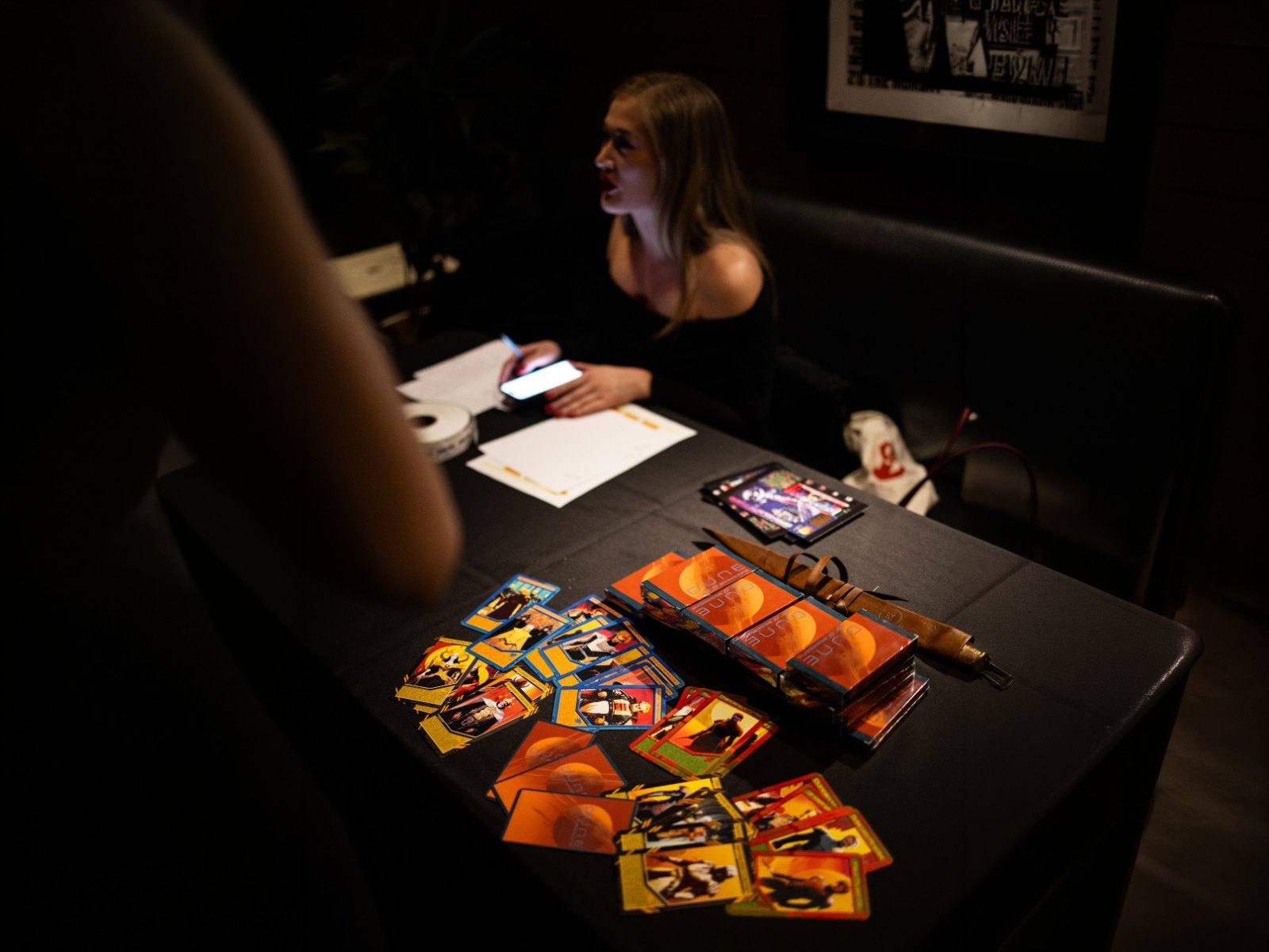 Collectible cards laid out across the check-in table